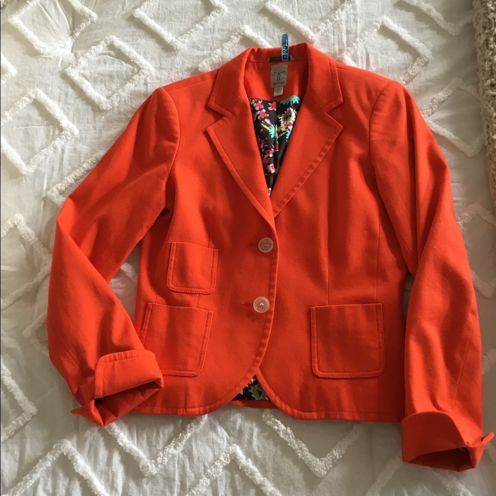 Superb orange jacket with beautiful floral lining.